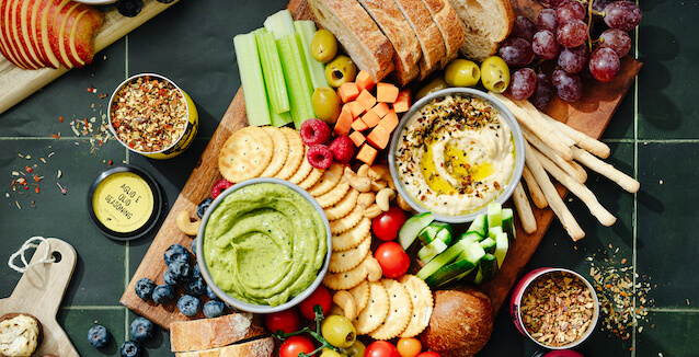 Vegan sharing board from Just Spices with vegetables, vegan dips and crackers